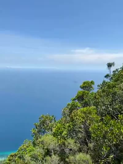 Looking down at Kampung Mukut and the fringing reef from near the top.